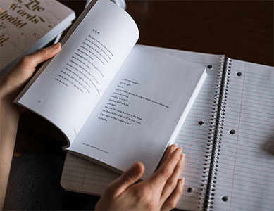 An English student reading one of our course textbooks.