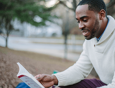 An English student reading one of our course textbooks.